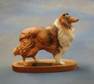 A Beswick figure of a Collie (rough), raised on a wooden base