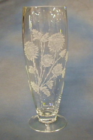 A tall glass vase with etched sunflower decoration 17"