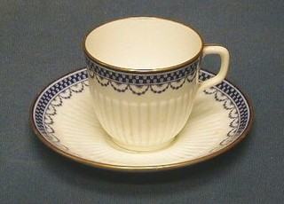 A miniature Royal Worcester cup and saucer, the base with purple mark and 15 dots