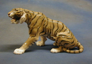 A Continental porcelain figure of a snow leopard 7"