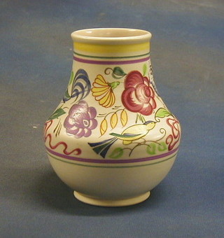 A 1960's Poole baluster shaped vase with floral decoration, the base with dolphin mark, handmade Poole and incised 443 7"