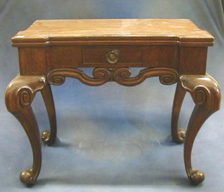 An Art Nouveau Century Continental carved table fitted a frieze drawer and raised on cabriole supports 31"