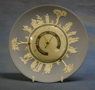 A Wedgwood blue Jasperware plate, the centre set an aneroid barometer by Scot & Mason 10"