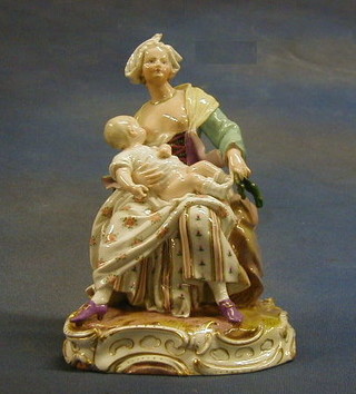 A Meissen porcelain figure of a seated mother and child, the base incised 5J B75 (r) 7"