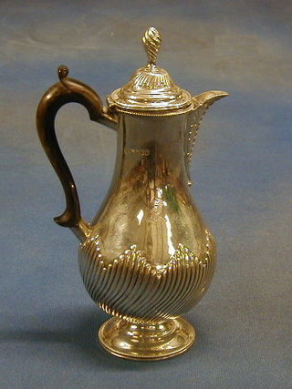 A Victorian, Georgian style silver hotwater ewer with beech handle and demi-reeded decoration, London 1883, 11 ozs (some salt corrosion)