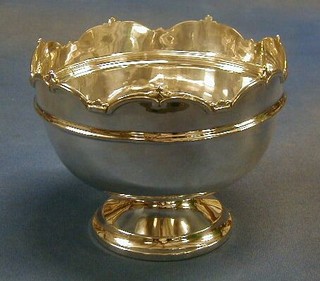 A circular silver  pedestal bowl with wavy rim, raised on a circular spreading foot, Birmingham 1935 by the Northern Goldsmiths Co. 11 ozs