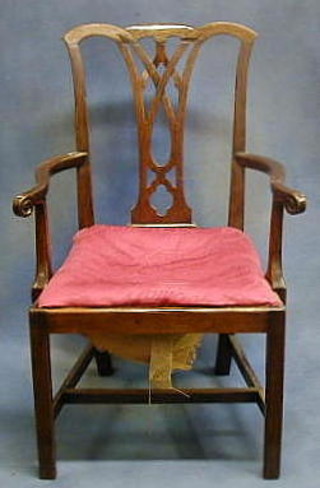 An 18th/19th Century Chippendale style mahogany open arm desk chair with pierced vase splat back and upholstered drop in seat, raised on square supports with H framed stretcher