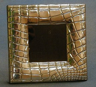 A modern silver photograph frame 7"