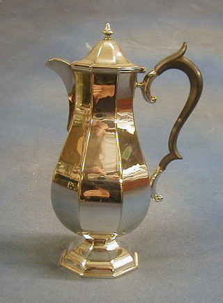 A silver plated hotwater jug of octagonal form