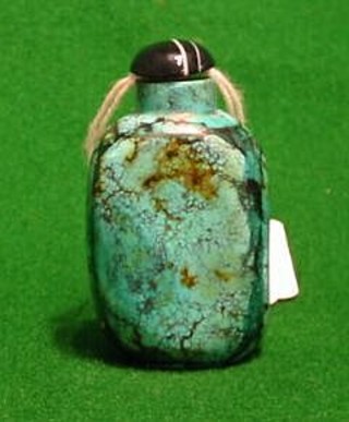 A 19th Century Oriental turquoise snuff bottle of rounded form, 2"