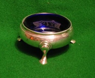 A Hester Bateman Georgian silver salt with blue glass liner, raised on 3 hoof supports (marks rubbed)