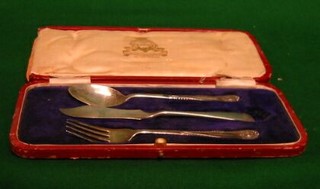 A silver knife and fork christening set and a non matching Old English pattern butter knife