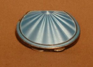 An Art Deco silver and green enamelled lady's compact Birmingham 1934 with Jubilee hallmark and a chromium plated match slip (2)