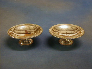 2 circular engraved silver comports, on circular bases 6"