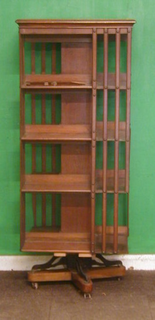 A large Victorian square mahogany revolving bookcase 24"