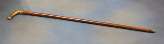 A Victorian walking stick with silver band and stag horn handle