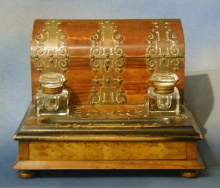 A Victorian walnutwood and brass banded ink standish with raised stationery box with hinged lid, the base fitted 2 inkwells with pen recess, the base fitted a drawer 12"