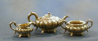 A George IV Scottish silver 3 piece tea service of melon form comprising teapot, twin handled sugar bowl and cream jug, raised on panel supports Edinburgh 1829, 43 ozs