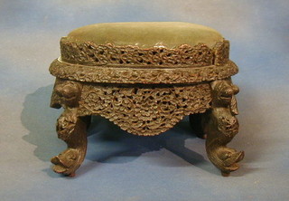 A 19th Century oval carved and pierced Eastern hardwood stool 16"