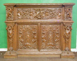 A handsome and fine quality 18th/19th Century carved Italian walnutwood cabinet, having fall front to the centre flanked by a pair of cupboards carved horses heads, above a double cupboard enclosed by panelled doors, carved a semi-naked classical maiden and flanked by a pair of carved figures, carved throughout, 69"