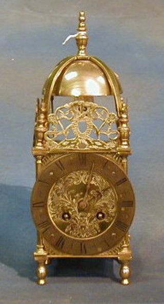 A French brass reproduction 17th Century style lantern clock with striking carriage clock movement, contained in a brass case