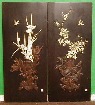 A pair of fine quality 19th Century ivory and hardwood lacquered panels decorated birds amidst flowering branches