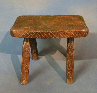 An 18th/19th Century oak stool raised on square supports 10", carved ET