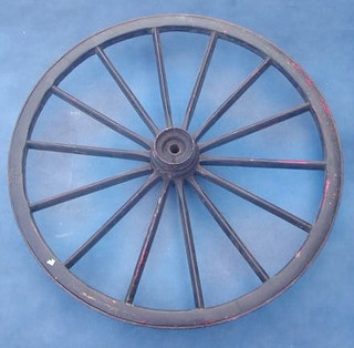 A large wooden and iron shod cart wheel 44"
