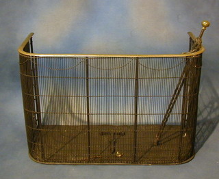 A brass and mesh nursery spark guard complete with pair of fire tongs 30"