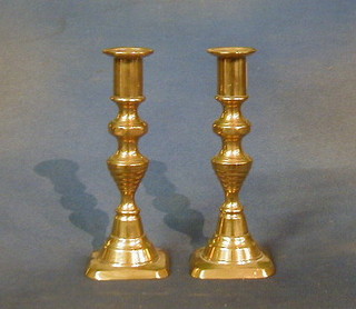 A pair of 19th Century brass candlesticks with ejectors 7"