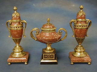 A 20th Century pink veined marble and gilt ormolu garniture of urns