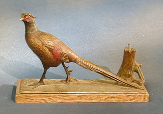 A bronze table lighter in the form of  a pheasant raised on an oak plinth 12"