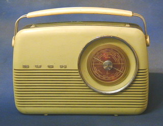 A Bush radio contained in a yellow plastic case Type TR82C receiver