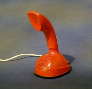 A 1960's  Swedish Designer red plastic upright dial telephone by L M Eiasson