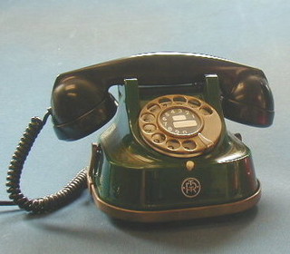 A 20th Century Belgian bell telephone contained in a green metal case