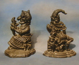 A pair of reproduction Victorian door stops in the form of Punch and Judy