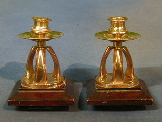 A pair of brass candlesticks