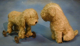 A childs push-a-long dog toy and a figure of a dog 10-20