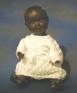 Armand Marseille porcelain headed black baby, the head incised AM Germany 518/3 1/2