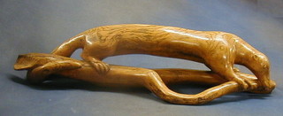 A carved wooden sculpture of an "Ant Eater" 23"