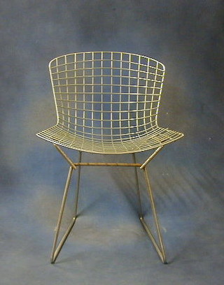 In the manner of Henry Batoa, a pair of chromium plated and woven metal dining chairs