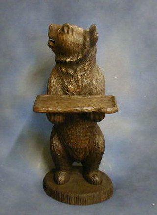 A Bavarian carved wooden figure of a bear supporting a tray 39"