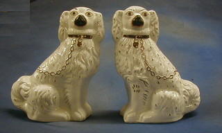 A pair of 19th Century Staffordshire figures of seated Spaniels 12"