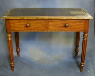 A Victorian mahogany writing/side table with inset tooled writing surface above 2 long drawers, raised on turned and reeded supports 39"