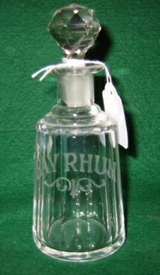 A Victorian cut and etched glass faceted decanter marked Bay Rhum 6"