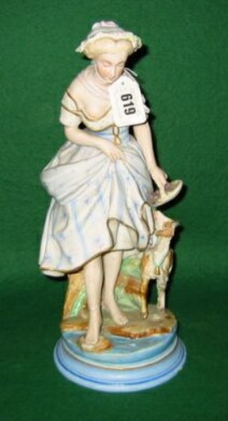 A  19th Century Continental biscuit porcelain figure of a standing shepherdess and ram 3" (f)