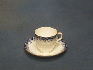 A miniature Royal Worcester cup and saucer, the base with purple mark and 15 dots