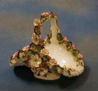A 19th Century Longton? porcelain basket with floral encrusted decoration