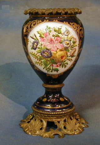 A 19th Century French porcelain oil lamp reservoir with gilt metal ormolu mounts 14"