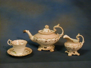 A 31 piece Rockingham style tea service comprising teapot, sucrier and cream jug, circular bread plate, 11 cups and 11 saucers 